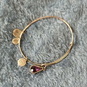 Elegant Gold Bracelet with Purple Gemstone